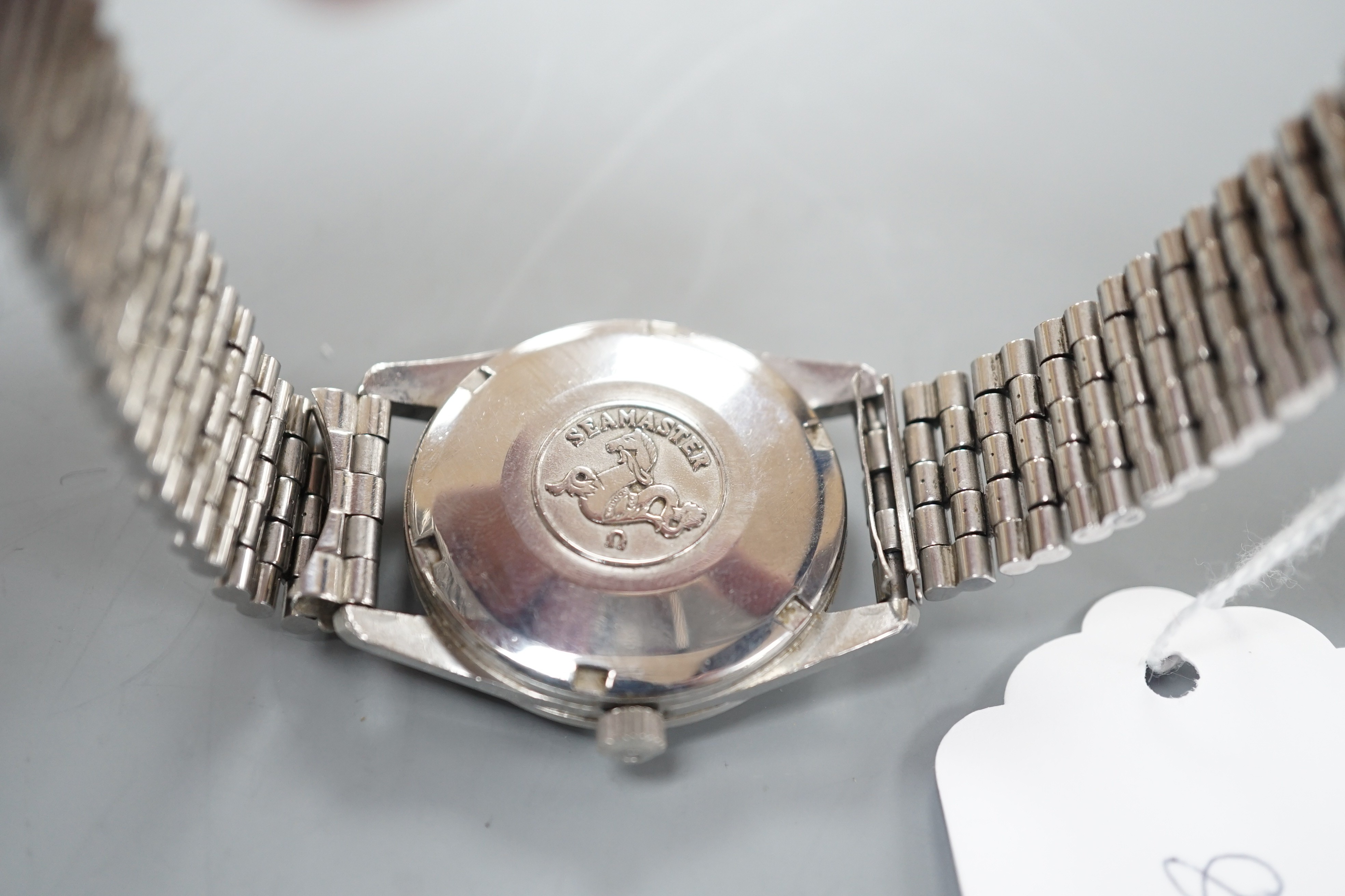 A gentleman's early 1960's stainless steel Omega Seamaster automatic wrist watch, with baton numerals and date aperture, movement c.562, on steel Omega bracelet.